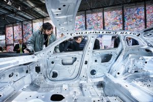 Image of A Man Working On A Car Body Sidewalls in Welding Shop of the Automobile Enterprise